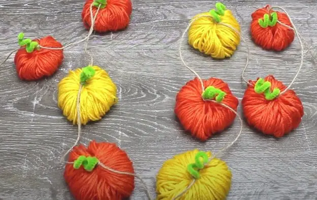 29+ Dollar Tree Fall Decor DIY Ideas for a Beautiful Budget Friendly Home 9 Yarn Pumpkin Garland