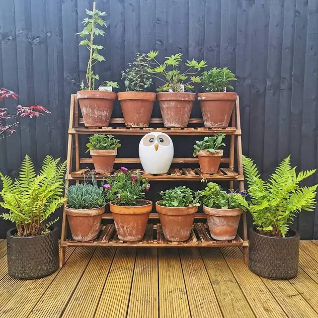 27 Kitchen Garden Ideas for a Beautiful and Productive Space 17 Tiered Terracotta Pot Display