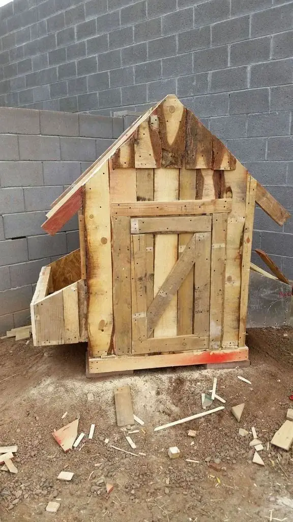 21 Pallet Chicken Coop Ideas for a Budget-Friendly Build 8 Rough Sawn Natural Wood Structure