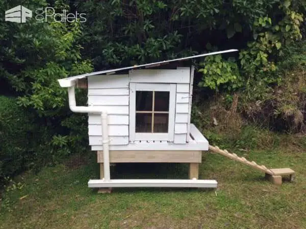 21 Pallet Chicken Coop Ideas for a Budget-Friendly Build 11 White Cottage Coop with Gutters