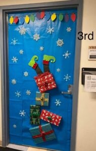 29+ Christmas Classroom Door Ideas That Are Easy & Cute 19 Upside Down Present Drop
