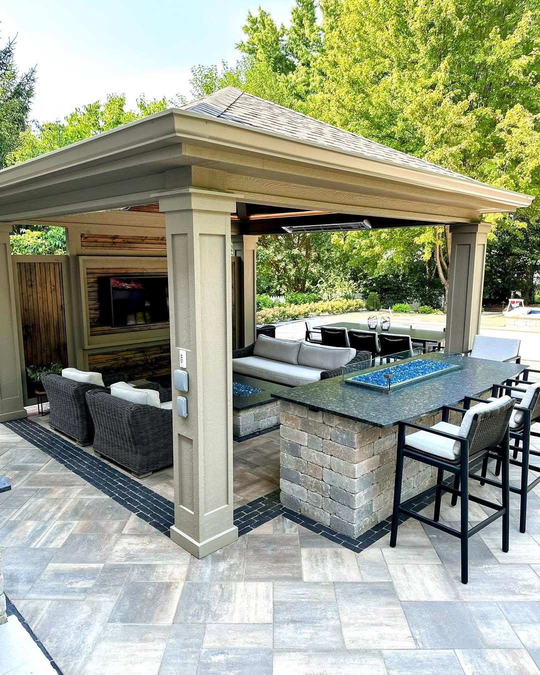 21 Covered Gazebo Ideas for a Beautiful and Cozy Outdoor Space 11 Deluxe Pavilion with Stone Fire Bar