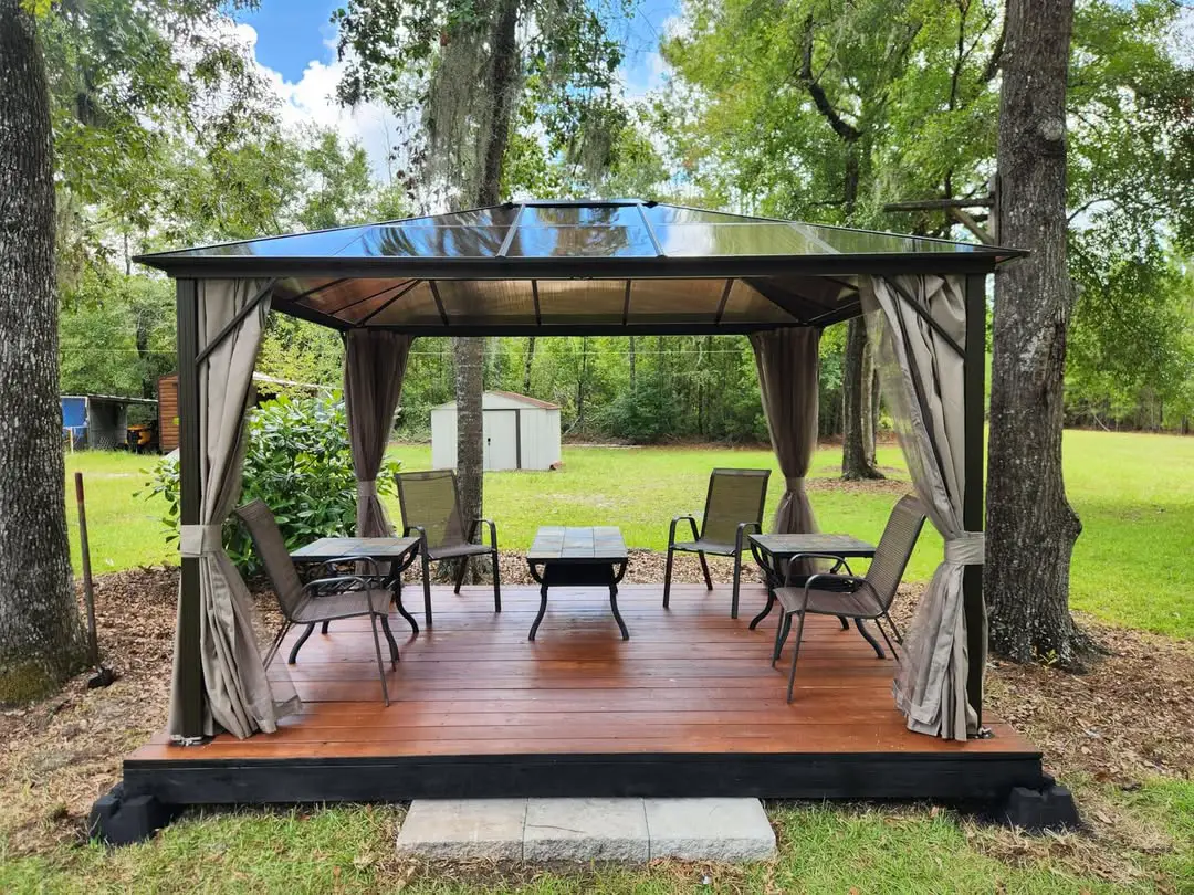 21 Covered Gazebo Ideas for a Beautiful and Cozy Outdoor Space 18 Hardtop Canopy on Elevated Deck