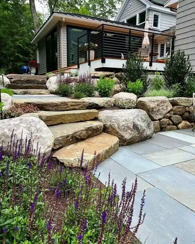 21 Boulders Landscaping Ideas for a Stunning Yard 5 Flagstone Steps and Boulder Retaining Wall