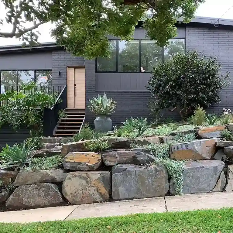 21 Boulders Landscaping Ideas for a Stunning Yard 8 Terraced Rock Wall Hillside