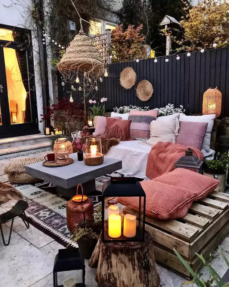 31+ Outdoor String Lighting Ideas for a Cozy and Beautiful Backyard 3 Boho patio lounge with warm string lights and woven lanterns