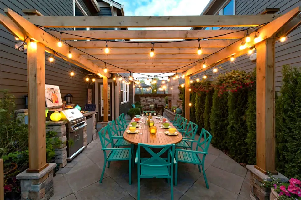 31+ Outdoor String Lighting Ideas for a Cozy and Beautiful Backyard 4 Wooden pergola dining area decorated with overhead string lights