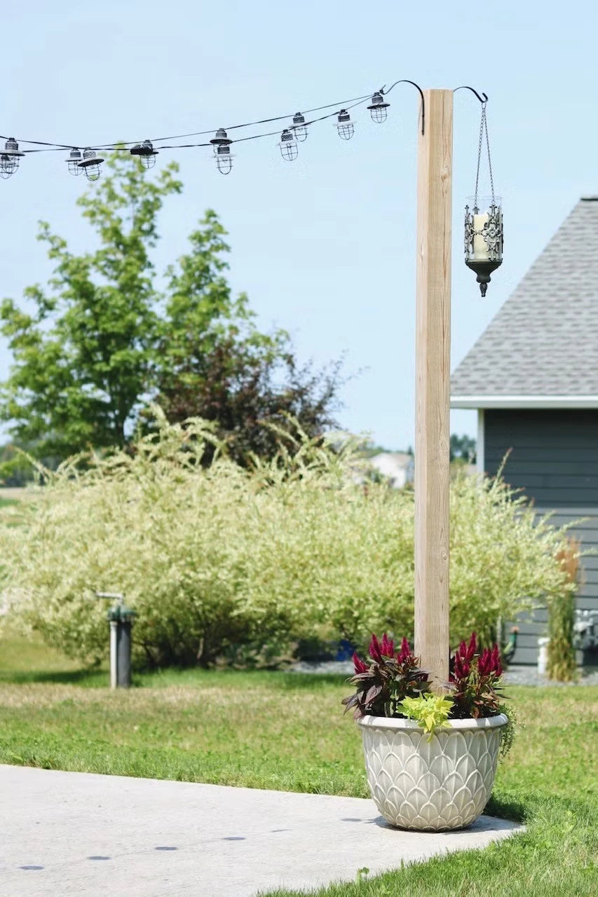 31+ Outdoor String Lighting Ideas for a Cozy and Beautiful Backyard 7 Wooden planter post supporting outdoor string lights with flowers