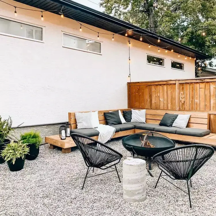 31+ Outdoor String Lighting Ideas for a Cozy and Beautiful Backyard 8 Modern outdoor fire pit corner with warm string lighting