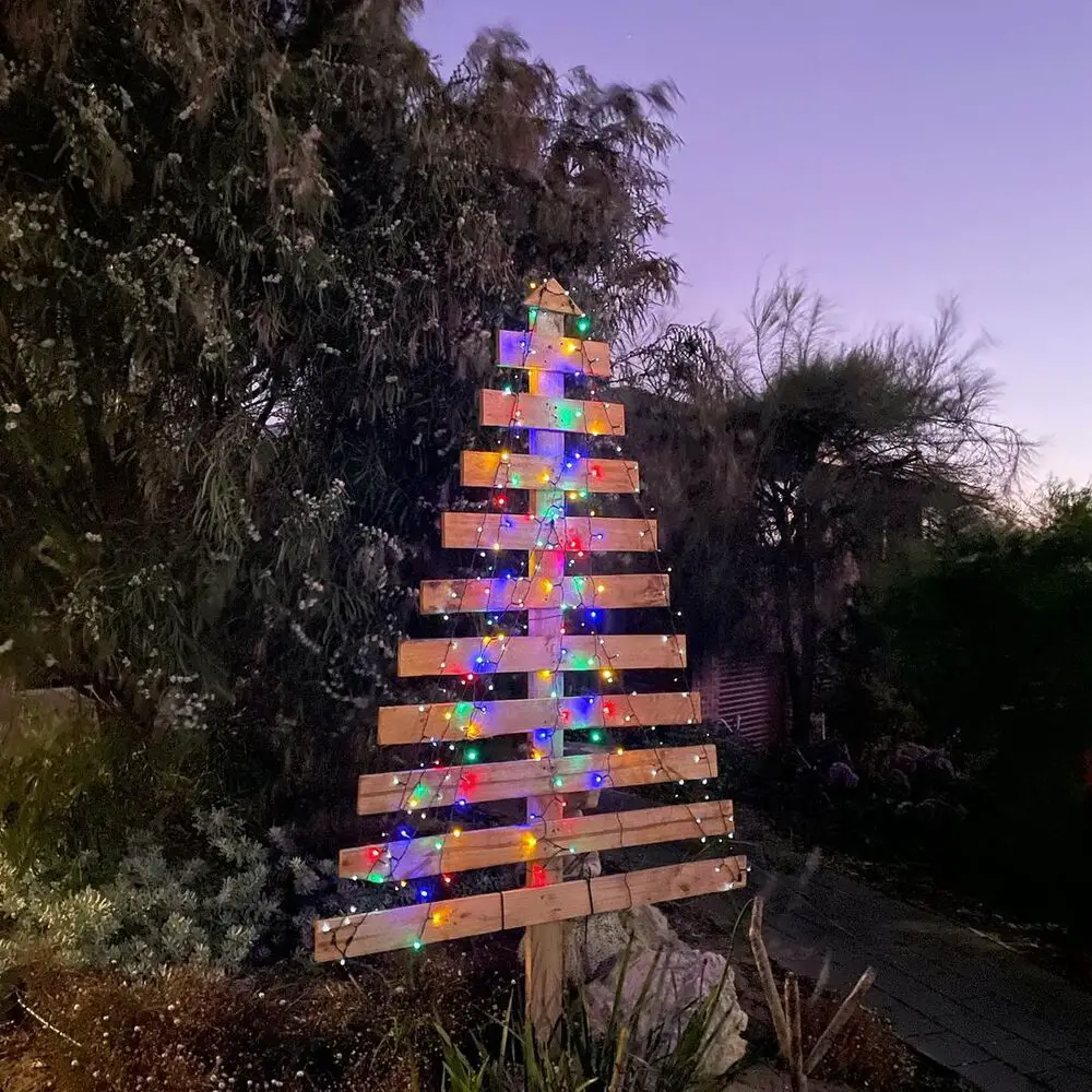 27+ Wood Christmas Trees DIY Ideas for Rustic and Creative Holiday Decor 12 Colorful Dusk Lighted Pallet Slat Tree