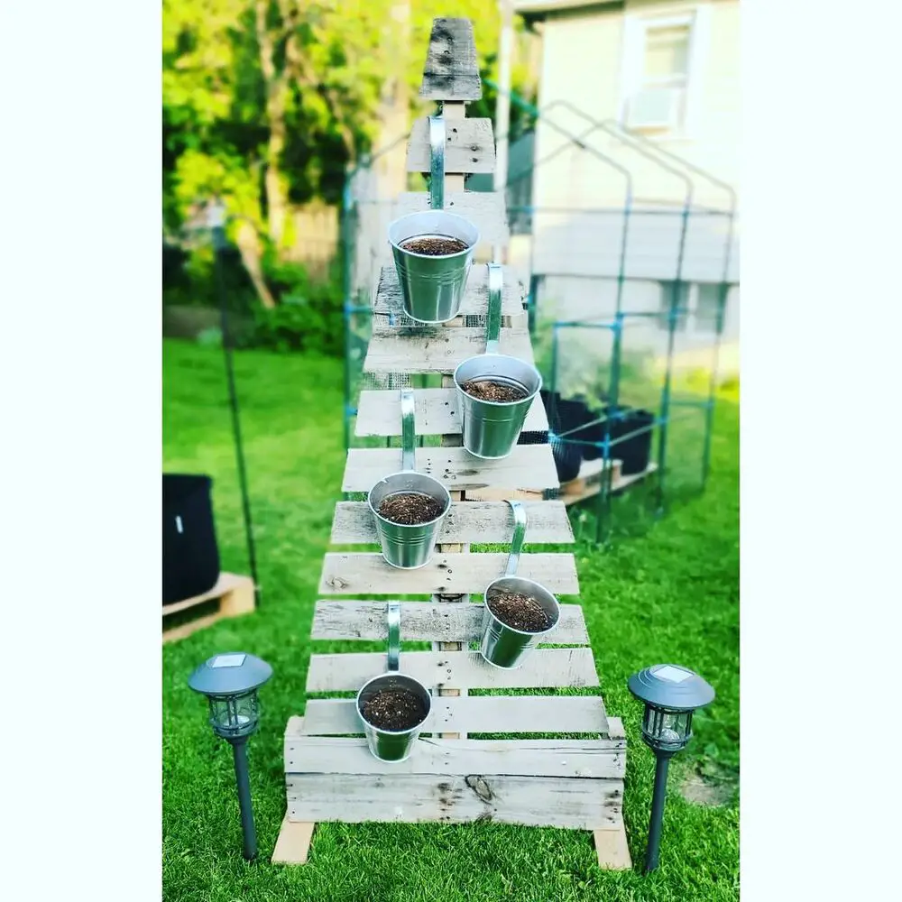27+ Wood Christmas Trees DIY Ideas for Rustic and Creative Holiday Decor 13 Vertical Pallet Garden Tree with Metal Buckets