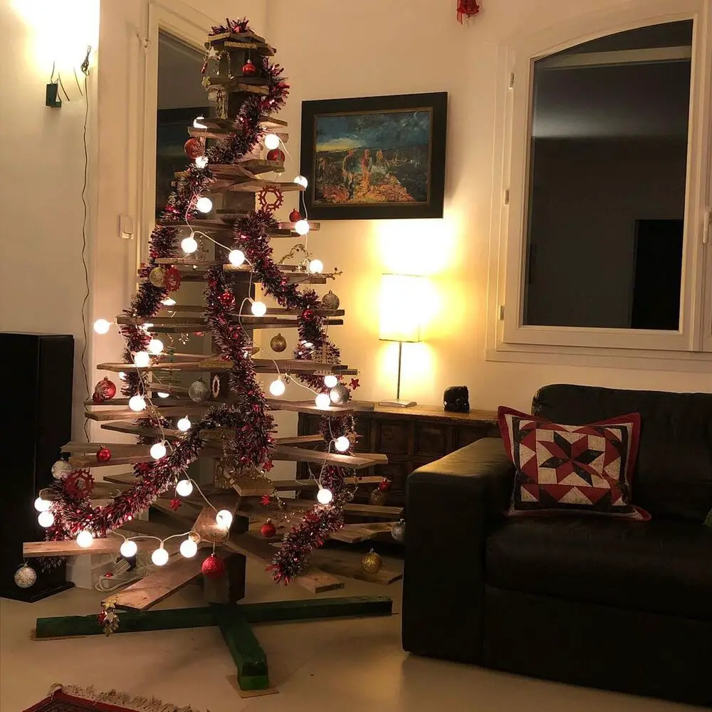 27+ Wood Christmas Trees DIY Ideas for Rustic and Creative Holiday Decor 18 3D Spiral Wooden Slat Tree with Red Tinsel