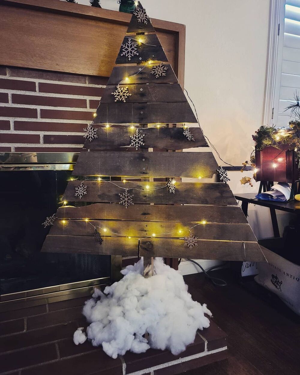 27+ Wood Christmas Trees DIY Ideas for Rustic and Creative Holiday Decor 20 Fireplace Hearth Wood Tree with Snowflake Cutouts