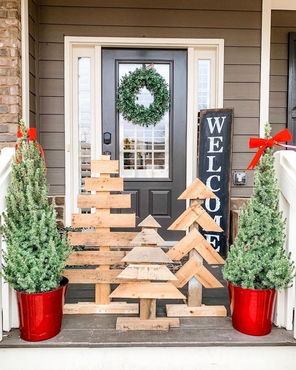 27+ Wood Christmas Trees DIY Ideas for Rustic and Creative Holiday Decor 22 Raw Wood Slat Trio Porch Display